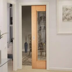 Eindhoven 1L Oak Single Evokit Pocket Door - Clear Glass - Prefinished